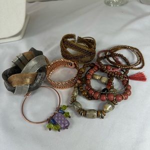 Large group of funky boho neutral tone bracelets